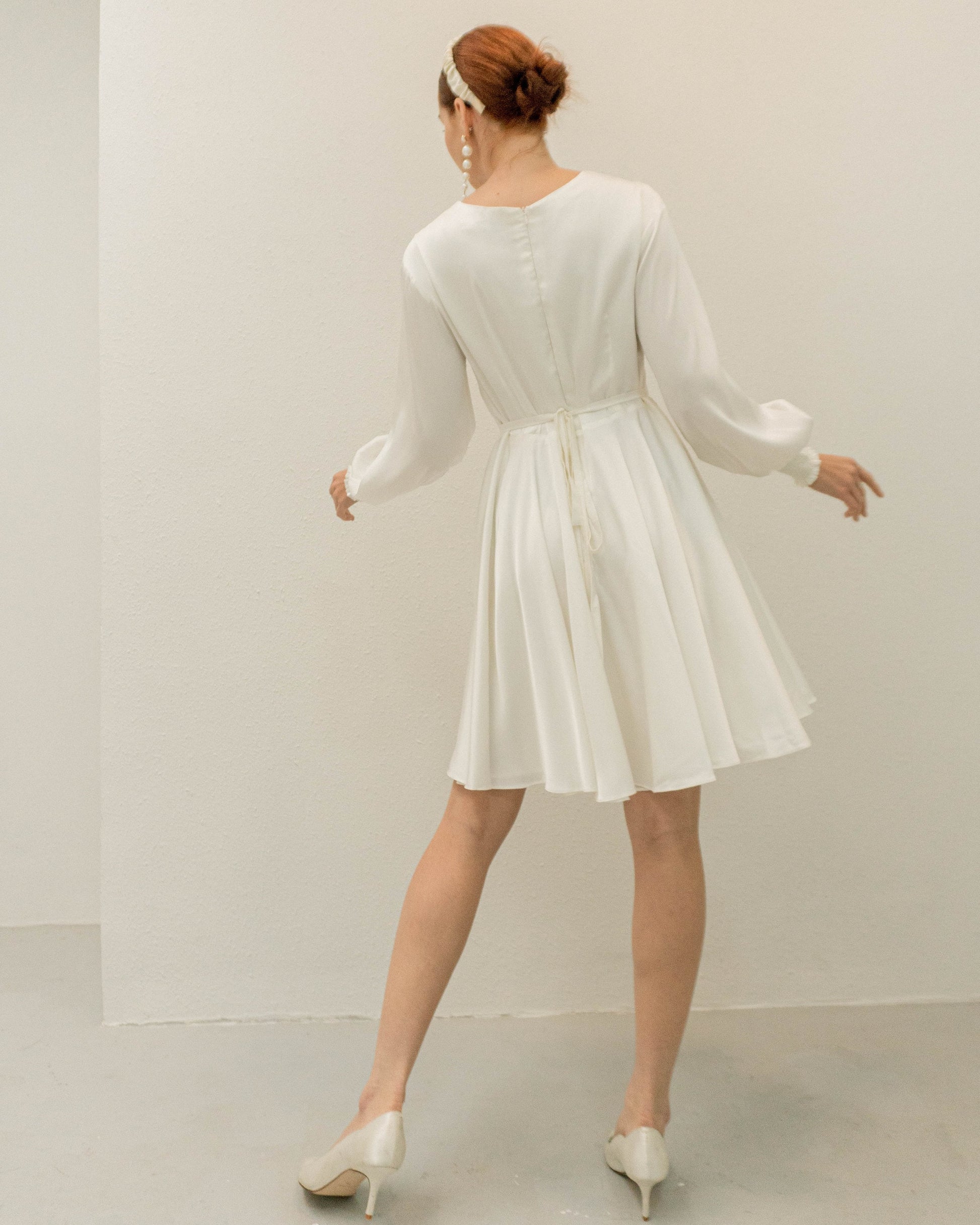 white dress with black sleeves Bardot Zephyra long sleeve mini dress in white